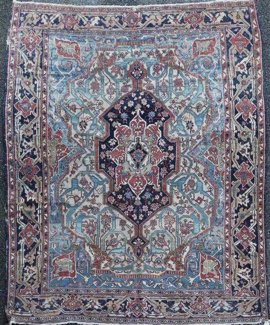 A late 19th/early 20th century Caucasian rug, 7ft 8in by 6ft 3in.